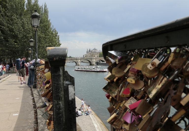 Barriers loaded with padlocks are pictured on the Pont des Arts in Paris on June 9, 2014