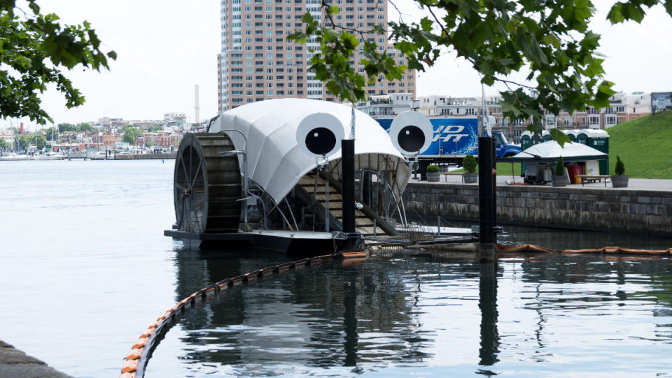 Mr. Trash Wheel, the mostly autonomous trash interceptor, cleaning up trash from a river in Baltimore.