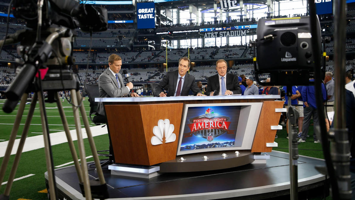 Al Michaels and Cris Collinsworth wore old-school hats with press