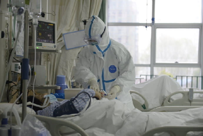 A picture released by the Central Hospital of Wuhan shows medical staff attending to patient at the The Central Hospital Of Wuhan Via Weibo in Wuhan