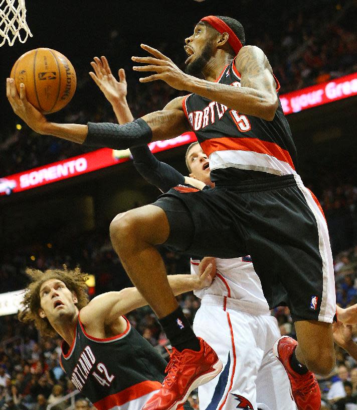 Trail Blazers guard Will Barton gets past Hawks forward Mike Muscala for two points during the second half of an NBA basketball game on Thursday, March 27, 2014, in Atlanta. (AP Photo/Atlanta Journal-Constitution, Curtis Compton) MARIETTA DAILY OUT; GWINNETT DAILY POST OUT; LOCAL TV OUT; WXIA-TV OUT; WGCL-TV OUT