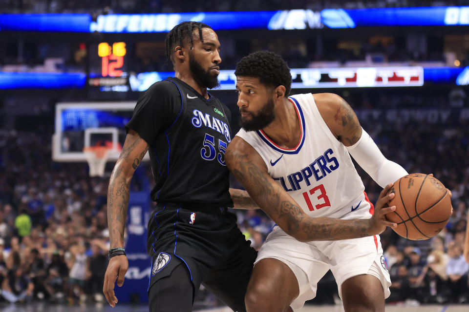 DALLAS, TEXAS - MAY 03: Paul George #13 of the LA Clippers drives the ball against Derrick Jones Jr. #55 of the Dallas Mavericks during the first quarter in Game Six of the Western Conference First Round Playoffs at American Airlines Center on May 03, 2024 in Dallas, Texas. (Photo by Ron Jenkins/Getty Images)