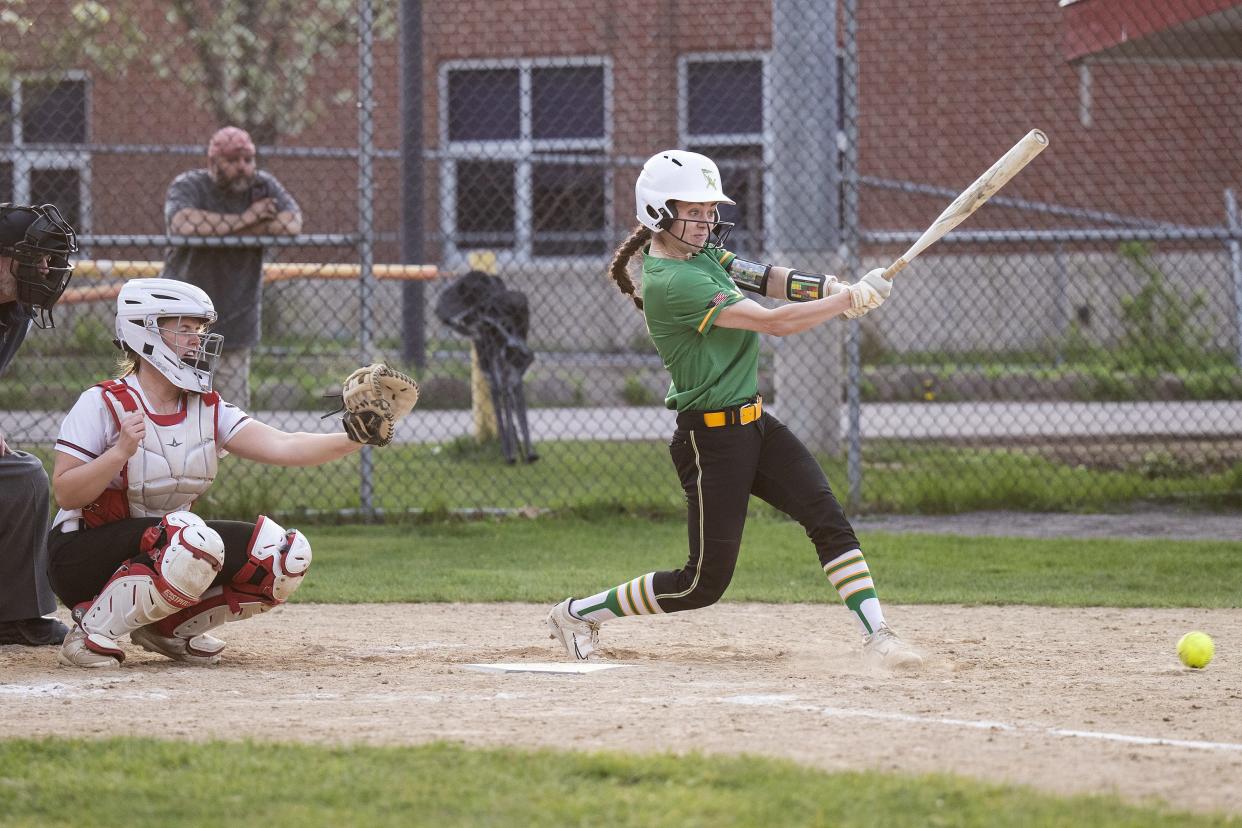 Clinton's Emily Johns singles during Monday's game against Hudson.