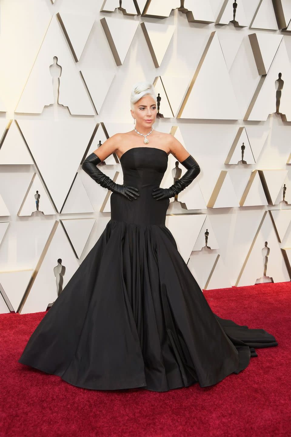 <p>Lady Gaga <a href="https://www.harpersbazaar.com/celebrity/red-carpet-dresses/a26500166/lady-gaga-audrey-hepburn-oscars-2019/" rel="nofollow noopener" target="_blank" data-ylk="slk:channelled Audrey Hepburn;elm:context_link;itc:0;sec:content-canvas" class="link ">channelled Audrey Hepburn</a> in a breath-taking, custom, sculptural black gown by Alexander McQueen. She paired the look with a 128-carat <a href="https://www.harpersbazaar.com/celebrity/red-carpet-dresses/a26362164/lady-gaga-oscars-2019-tiffany-diamond/" rel="nofollow noopener" target="_blank" data-ylk="slk:Tiffany diamond necklace;elm:context_link;itc:0;sec:content-canvas" class="link ">Tiffany diamond necklace</a> and perfectly Gaga elbow-length black leather gloves.</p>