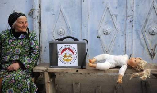 An elderly woman sits next to a portable ballot box during an election in Tskhinvali, the capital of Georgia's maverick region of South Ossetia, on April 8, 2012. Georgia's breakaway region of South Ossetia held a run-off vote to elect a leader after months of political turmoil