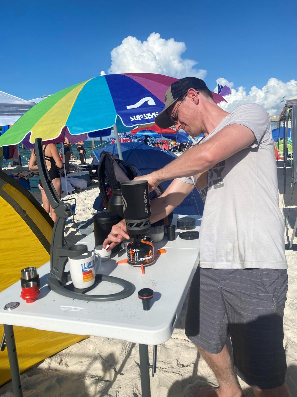 What started out as a pandemic impulse buy has made Kendall Foust one of the most popular people on the beach. He spent the morning making expresso for passersby on his manual espresso press on Saturday, July 9, 2022.