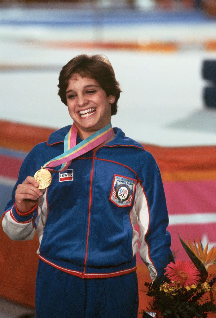 <p>Mary Lou Retton became a darling of American gymnastics after her performance at the 1984 Los Angeles Olympics. Her routines, two of which earned perfect scores, led her to become the <a href="https://www.britannica.com/biography/Mary-Lou-Retton" rel="nofollow noopener" target="_blank" data-ylk="slk:first American woman;elm:context_link;itc:0;sec:content-canvas" class="link ">first American woman</a> to win an individual gold medal in gymnastics. </p>