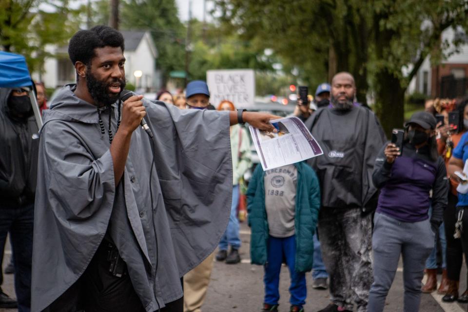 Councilman Jecorey Arthur speaks to community members during a prayer vigil for the victims of Wednesday morning's bus stop shooting.  Sept. 22, 2021