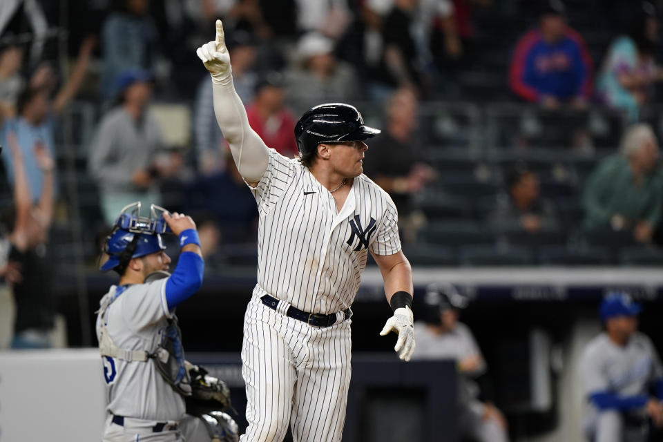 New York Yankees Luke Voit reacts as he watches his game-winning, ninth inning RBI single to defeat the Kansas City Royals 6-5 in a baseball game, Wednesday, June 23, 2021, at Yankee Stadium in New York. Royals catcher Sebastian Rivero, left, watches the ball's path. (AP Photo/Kathy Willens)