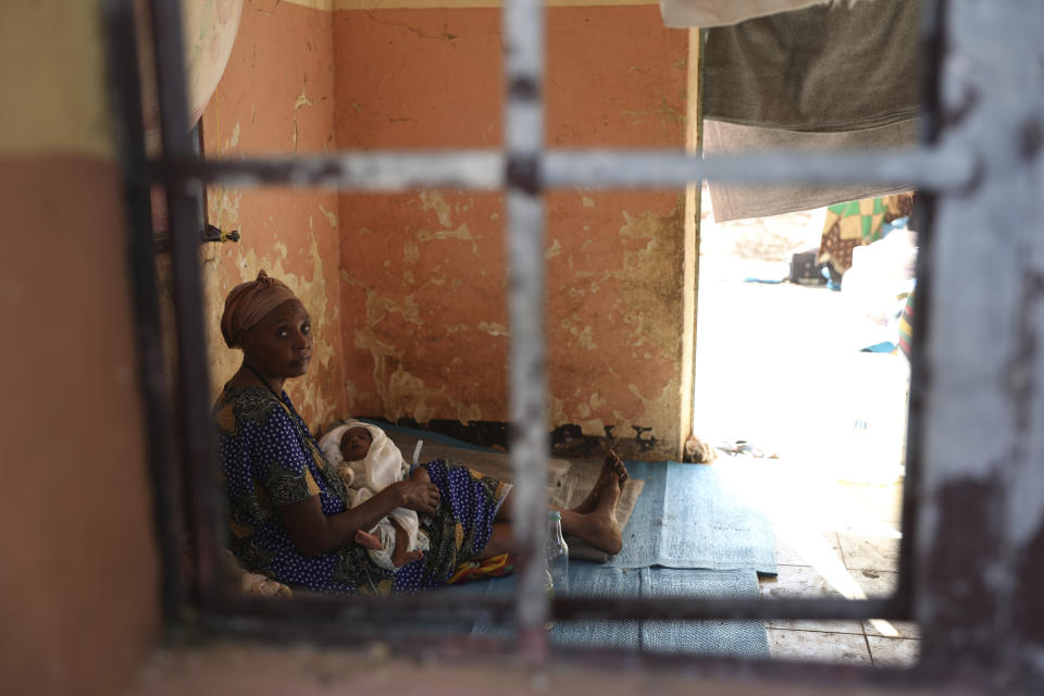 Ethiopian refugees rest in Qadarif region, easter Sudan, Friday, Nov 20, 2020. Thousands of Ethiopians fled the war in Tigray region into Sudan. (AP Photo/Marwan Ali)