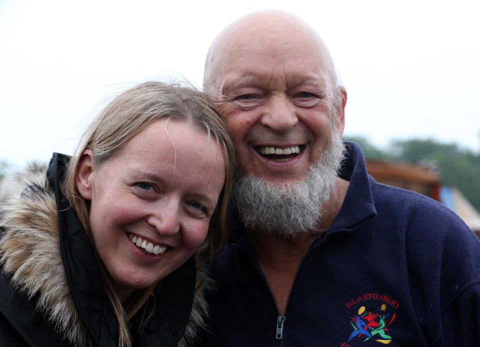 GLASTONBURY, ENGLAND - JUNE 27:  Festival founder Michael Eavis and his daughter Emily pose for a photograph at the Glastonbury Festival of Contemporary Performing Arts site at Worthy Farm, Pilton on June 27, 2013 near Glastonbury, England. Gates opened on Wednesday at the Somerset Diary Farm that will be playing host to one of the largest music festivals in the world and this year features headline acts Artic Monkeys, Mumford and Sons and the Rolling Stones. Tickets to the event which is now in its 43rd year sold out in minutes and that was before any of the headline acts had been confirmed. The festival, which started in 1970 when several hundred hippies paid 1 GBP to watch Marc Bolan, now attracts more than 175,000 people over five days.  (Photo by Matt Cardy/Getty Images)