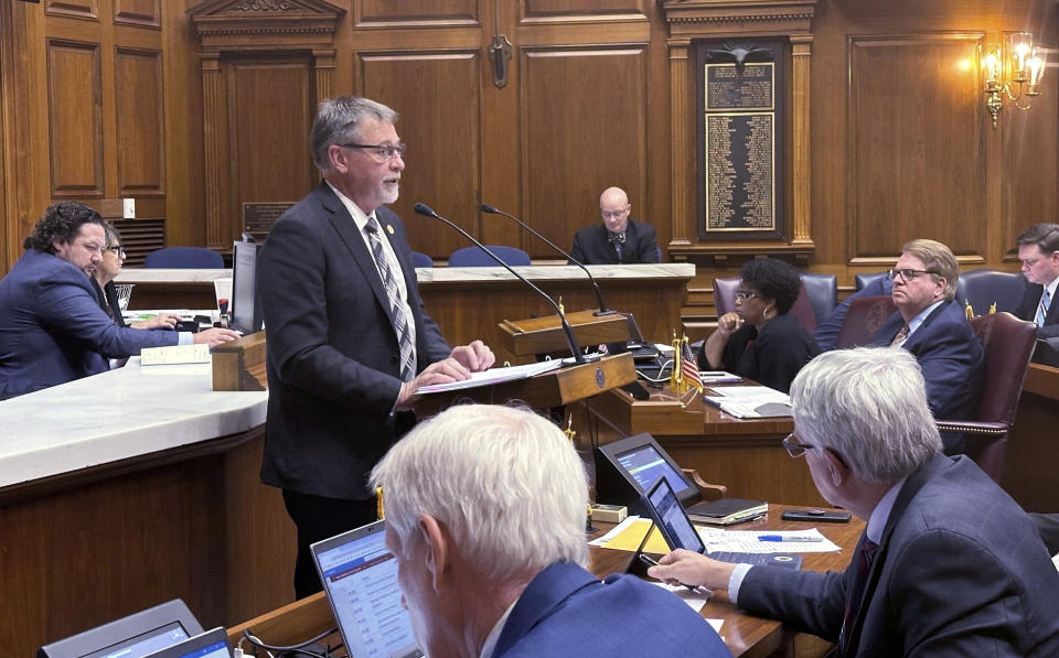 Indiana state Rep. Jim Pressel asks lawmakers to support House Bill 1162 in the House chamber at the Indiana Statehouse, Monday, Feb. 5, 2024 in Indianapolis. The bill would repeal a law passed last year that allows certain immigrants from Ukraine to receive driver's licenses following a discrimination lawsuit filed by the ACLU of Indiana and the National Immigration Law Center. (AP Photo/Isabella Volmert)