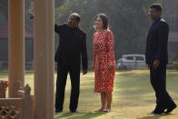 German Foreign Minister Annalena Baerbock, is being briefed by Vijay Goel, vice chairman, left, Gandhi Smriti, a place where Mahatma Gandhi spent the last days of his life and was assassinated, during her visit at the memorial in New Delhi, Monday, Dec. 5, 2022. Baerbock is on a two days official visit to India. (AP Photo/Manish Swarup)