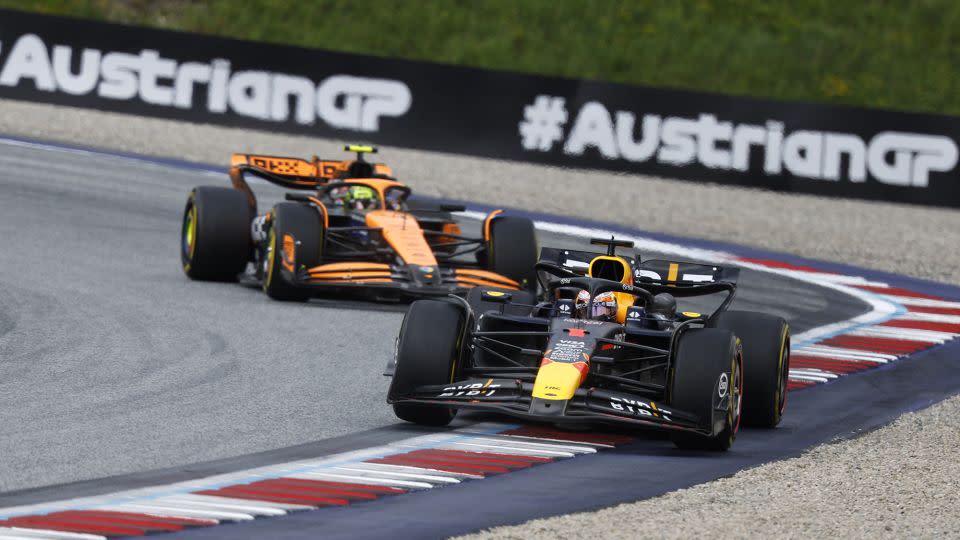 Red Bull's Max Verstappen and McLaren's Norris were locking horns throughout the race. - Erwin Scheriau/APA/AFP/Getty Images