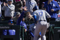 Los Angeles Dodgers' Shohei Ohtani is showered with sunflower seeds after hitting a home run during the fifth inning of a baseball game against the Chicago Cubs, Friday, April 5, 2024, in Chicago. (AP Photo/Erin Hooley)