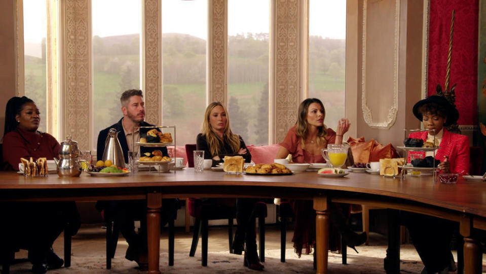 The cast sits at the breakfast table