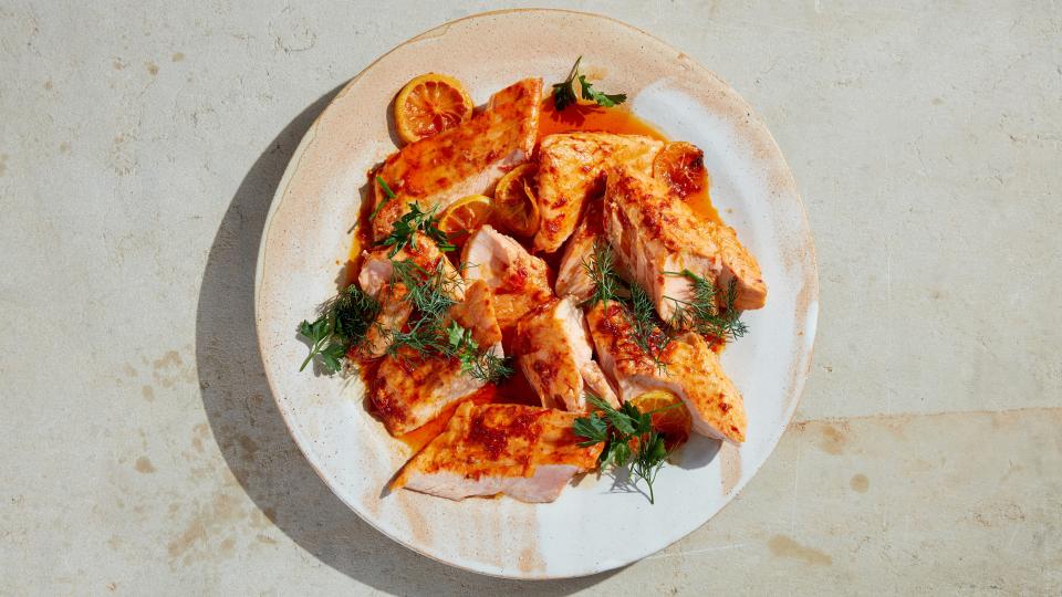 The first time we ran <a rel="nofollow noopener" href="https://www.bonappetit.com/recipe/slow-roasted-salmon-with-fennel-citrus-and-chiles?mbid=synd_yahoo_rss" target="_blank" data-ylk="slk:a recipe for slow-cooked salmon;elm:context_link;itc:0;sec:content-canvas" class="link ">a recipe for slow-cooked salmon</a> poached in olive oil, surrounded by fennel and citrus slices, and casually pulled apart, readers swooned. We swooned! It became an instant, oft-imitated classic. We’ve riffed on it ourselves, running flavor variations over the years, including this new one. The reason it has become such a staple: The low temp and abundance of olive oil make it nearly impossible to overcook. You’ll forget there’s any other way. <a rel="nofollow noopener" href="https://www.bonappetit.com/recipe/slow-roasted-salmon-with-harissa?mbid=synd_yahoo_rss" target="_blank" data-ylk="slk:See recipe.;elm:context_link;itc:0;sec:content-canvas" class="link ">See recipe.</a>