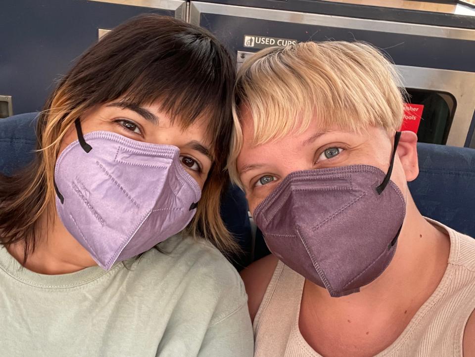 My wife and i with our masks on in the train