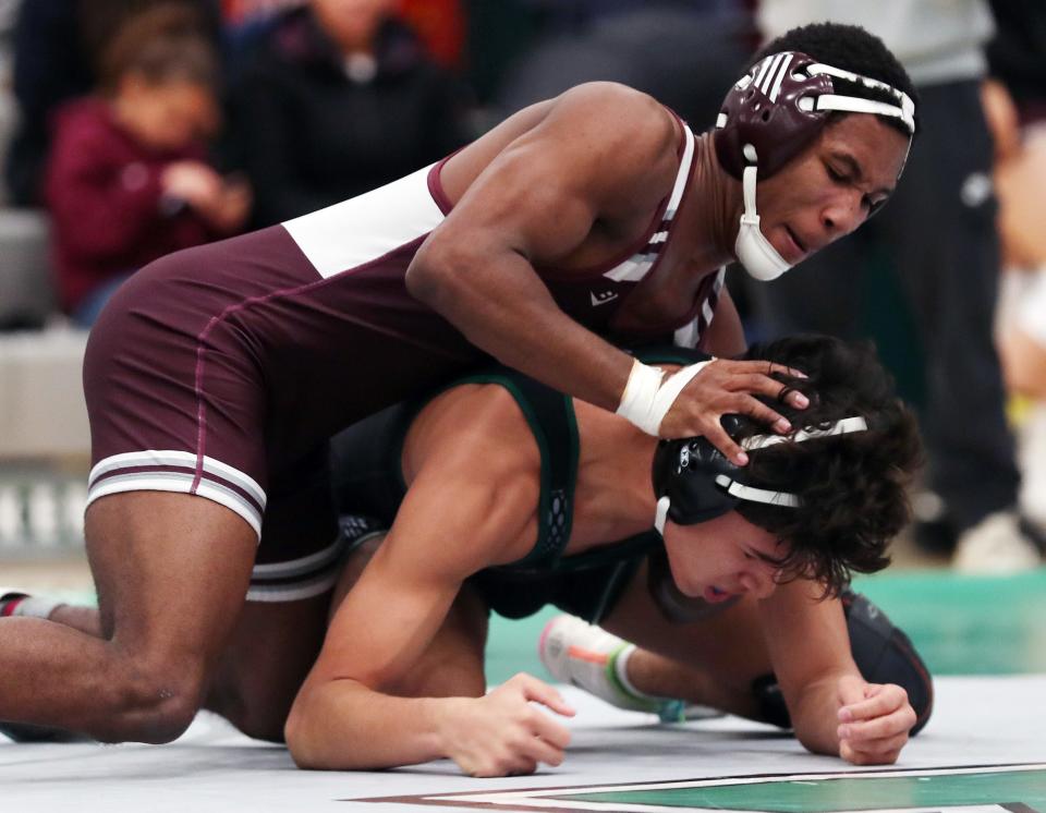 Nick Duran from Yorktown and Giovanni JeanPierre from Ossining wrestle in the 160-pound weight class during the Section 1 Division I Dual Meet Tournament at Yorktown High School Dec. 21, 2023. JeanPierre won the match.