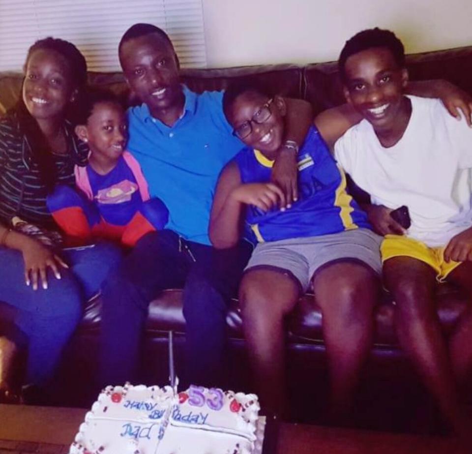 Calgary father Norbert Munyarusisiro celebrates his birthday with his four children, from left to right, Grace Uwera, Greta Mutesi, Grady Mucyo and Patient Mugisha.