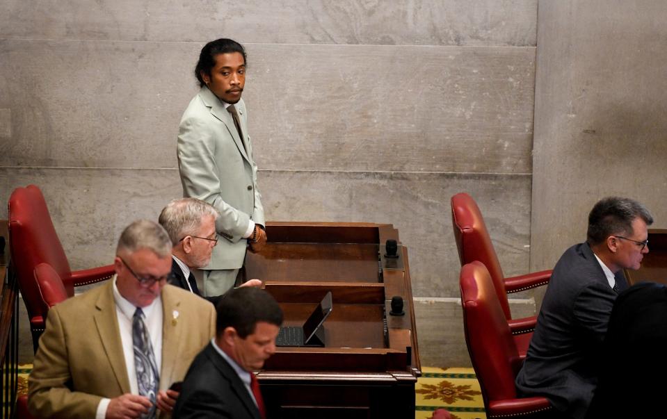 Justin Jones, D-Nashville, returns to his desk at the Tennessee State Capitol after the Nashville's Metro Council reappointed him to the House of Representatives on Monday, April 10, 2023, after his expulsion last week.