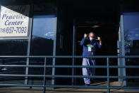 Dr. Alan Roth walks to his office after an interview at Jamaica Hospital Medical Center in New York, Tuesday, Dec. 29, 2020. Dozens of clinics have cropped up around the U.S. to address a puzzling and troubling aspect of COVID-19 — the after-effects that can stubbornly afflict some people weeks or months after the infection itself has subsided. “We know this is real,” said Roth, who oversees the Jamaica Hospital clinic. He has been grappling with body pain, fatigue and “brain fog” characterized by occasional forgetfulness since his own relatively mild bout with COVID-19 in March. (AP Photo/Seth Wenig)