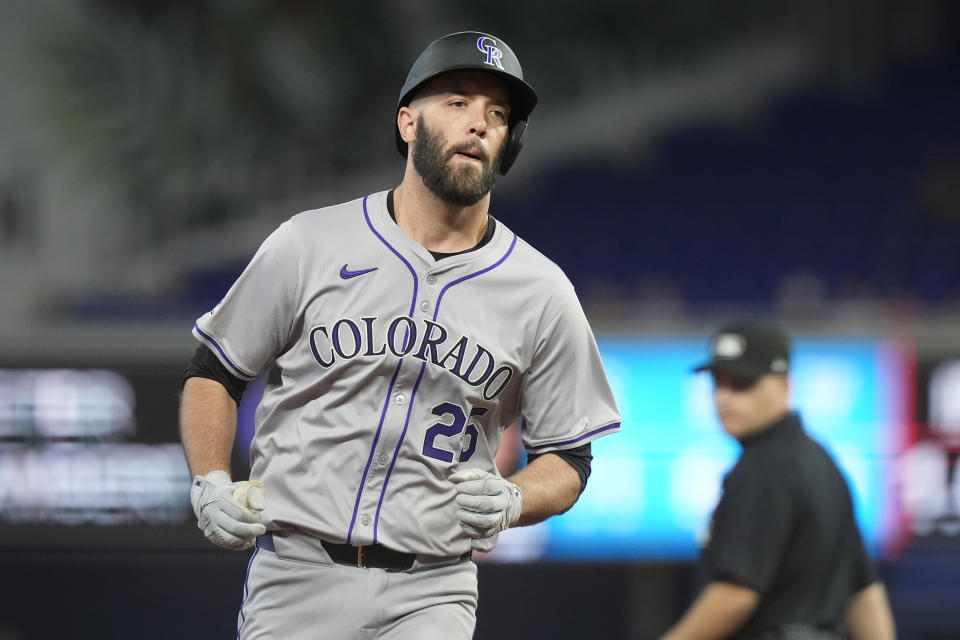 Colorado Rockies' Jacob Stallings (25) runs the bases after hitting a three-run home run during the second inning of a baseball game against the Miami Marlins, Thursday, May 2, 2024, in Miami. (AP Photo/Marta Lavandier)