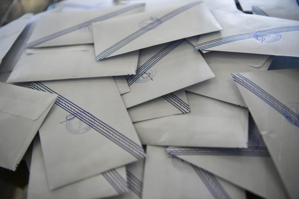 Ballots are seen inside a ballot box at a polling station in Athens, Greece, Sunday, June 25, 2023. Polls have opened in Greece for the second general election in less than two months, with the conservative party a strong favorite to win with a wide majority. (AP Photo/Michael Varaklas)