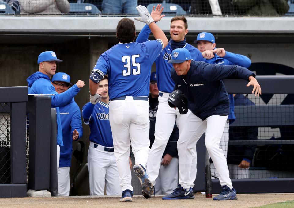 BYU’s Jacob Wilk celebrates a home run with teammates as BYU and Utah play a baseball game in Provo on Tuesday, March 14, 2023. BYU won 7-0. | Scott G Winterton, Deseret News