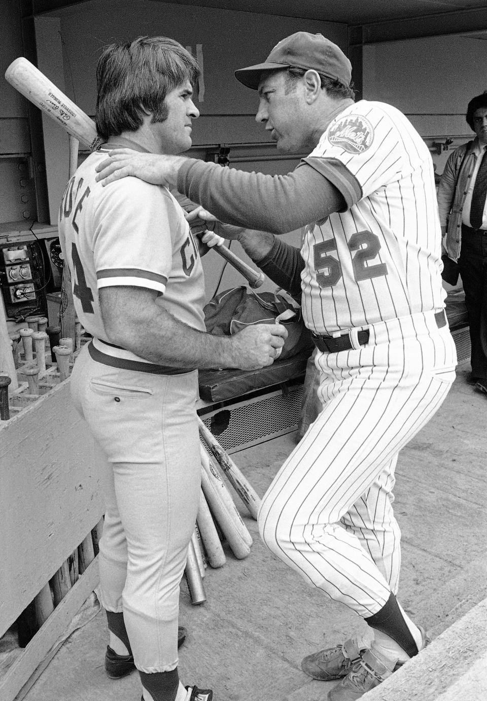 FILE - Joe Pignatano, right, a bullpen coach for the New York Mets, talks with Cincinnati Reds star Pete Rose in New York, July 27, 1978, before a baseball game. Pignatano, who made his major league debut with the Brooklyn Dodgers in 1957 and later was a coach for the Mets, died Monday, May 23, 2022, in Naples, Fla. (AP Photo/G. Paul Burnett, File)