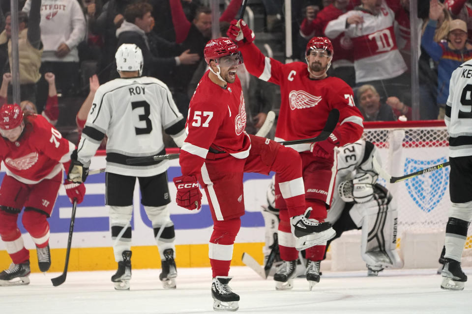 Detroit Red Wings left wing David Perron (57) celebrates his goal against the Los Angeles Kings in the third period of an NHL hockey game Monday, Oct. 17, 2022, in Detroit. (AP Photo/Paul Sancya)