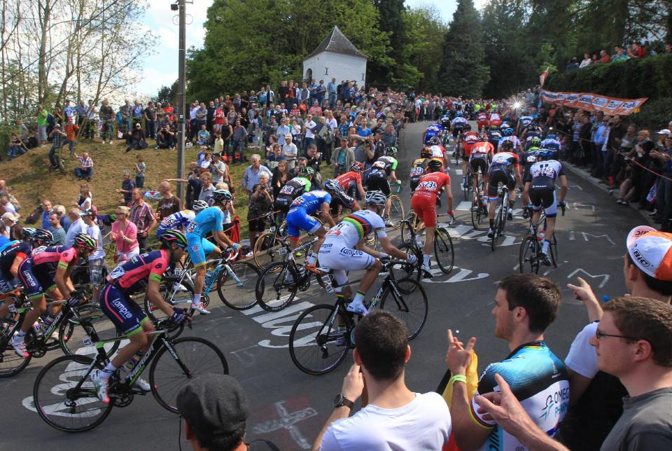 Cyclists climb the 'wall of Huy' during the Belgian cycling classic and UCI World Tour race Walloon Arrow/Fleche Wallonne, in Huy, Belgium, Wednesday, April 23, 2014. (AP Photo/Yves Logghe)