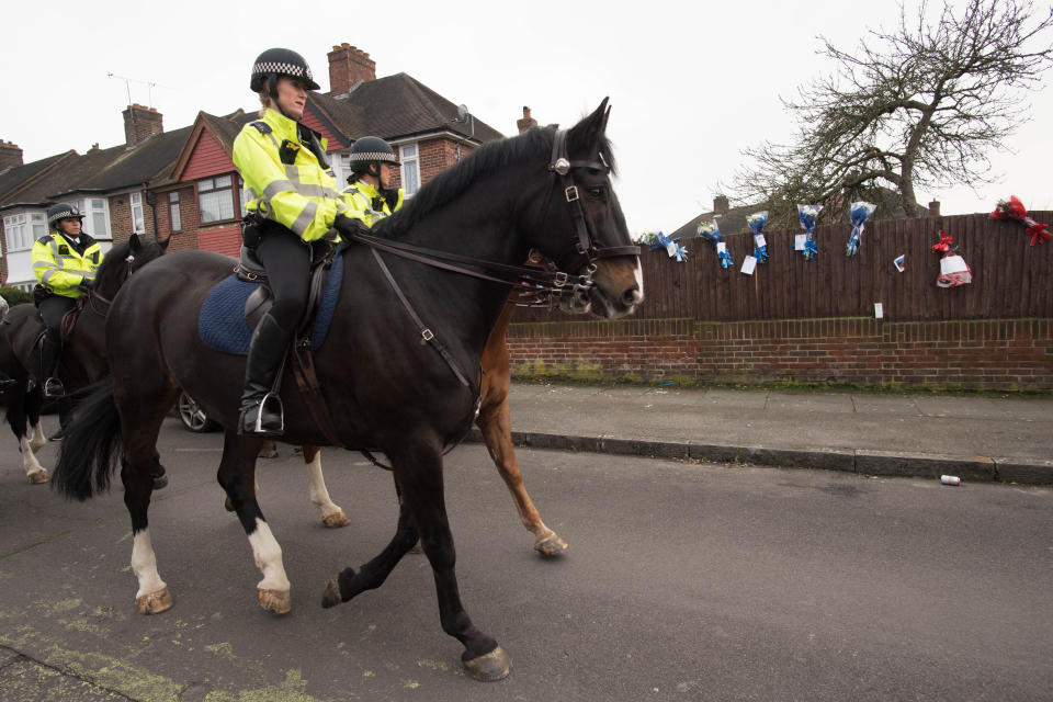 Police on horseback patrol the south London street (Picture: PA)