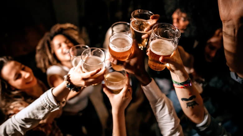 Friends cheersing with beers