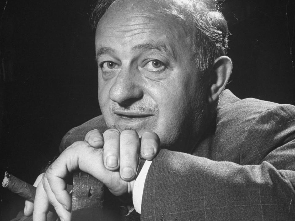 Ben Hecht smoking a cigar.