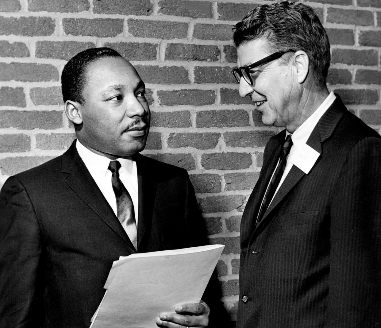 The Rev. Martin Luther King Jr., left, with an official, was the keynote speaker to officially opened a three-day conference on racial problems on Dec. 28, 1962. The session is being held in Underwood Auditorium on the University of Vanderbilt Law School campus and sponsored by the Fellowship of Southern Churchmen and the Southern Regional Council.