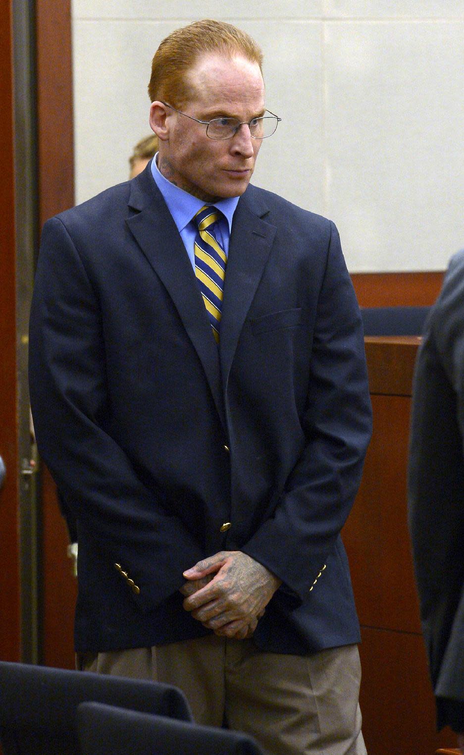Eric Millerberg enters the courtroom during his trial, Wednesday, Feb. 12, 2014, in Ogden, Utah. Millerberg has been charged with injecting his 16-year-old baby sitter, Alexis Rasmussen, with a fatal dose of heroin and methamphetamine, then taking his wife and infant daughter along to dump Rasmussen's body near a river. (AP Photo/The Salt Lake Tribune, Leah Hogsten, Pool)