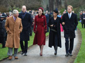 <p>The Duchesses wrapped up for Christmas 2018. Kate wore a burgundy double-breasted coat by Catherine Walker, with a Jane Taylor halo band, her Granvito Rossi 105 pumps in the bordeaux colourway and her Mulberry Bayswater clutch bag. She accessorised with her Asprey oak leaf earrings and a new floral brooch. Pregnant Meghan wore a navy overcoat and knee-high boots by Victoria Beckham, with a navy midi dress and matching hat. [Photo: PA] </p>