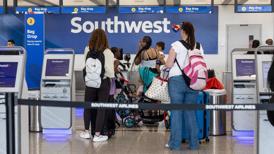 PHOTO: Travelers check in at the Southwest counter at Hartsfield-Jackson Atlanta International Airport (ATL) in Atlanta, Georgia, July 23, 2024. (Christian Monterrosa/Bloomberg via Getty Images)