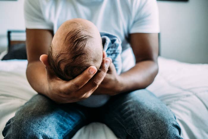 a dad holding his baby