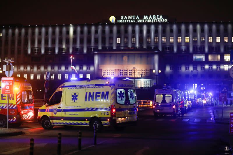 Medical personnel in ambulances with COVID-19 patients wait in the queue at Santa Maria hospital, amid the coronavirus disease (COVID-19) pandemic in Lisbon