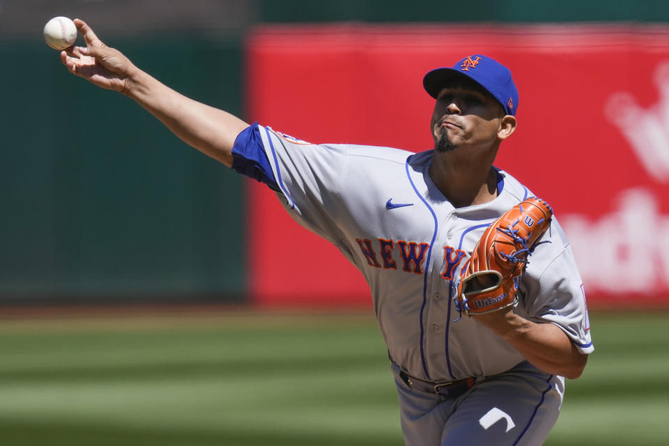 New York Mets pitcher Carlos Carrasco throws against the Oakland Athletics during the first inning of a baseball game in Oakland, Calif., Saturday, April 15, 2023. (AP Photo/Godofredo A. Vásquez)
