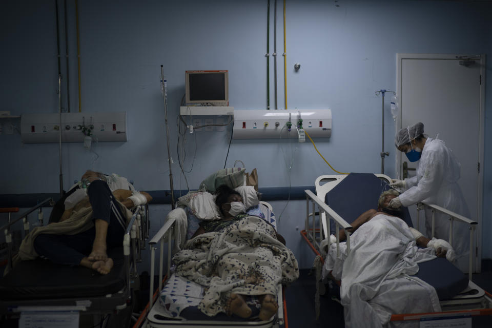 Patients waiting for test results are treated in a temporary room before being moved to a COVID-19 area of the municipal hospital in Sao Joao de Meriti, Rio de Janeiro state, Brazil, Thursday, April 8, 2021. (AP Photo/Felipe Dana)