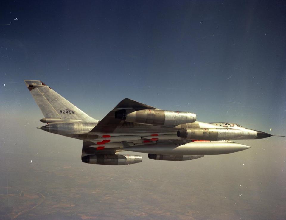 A B-58 Hustler bomber is photographed mid flight. 