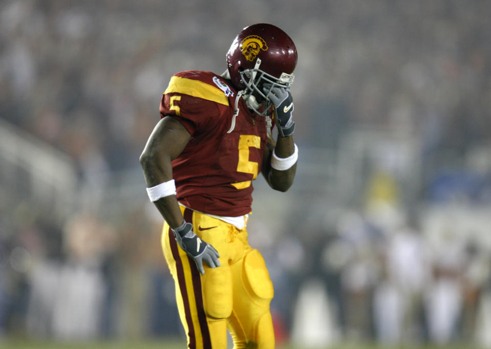 USC’s Reggie Bush is dejected after fumbling in second quarter action against the Texas Longhorns at the national championship game at the Rose Bowl Game in Pasadena, Wednesday, Jan. 4, 2006. (Getty Images)
