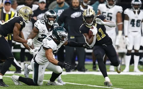 New Orleans Saints running back Alvin Kamara (41) runs against Philadelphia Eagles middle linebacker Jordan Hicks (58) and strong safety Malcolm Jenkins (27) during the third quarter of a NFC Divisional playoff football game at Mercedes-Benz Superdome - Credit: USA TODAY