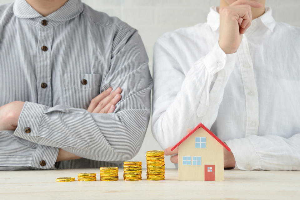 Man and woman talking about money and house problems