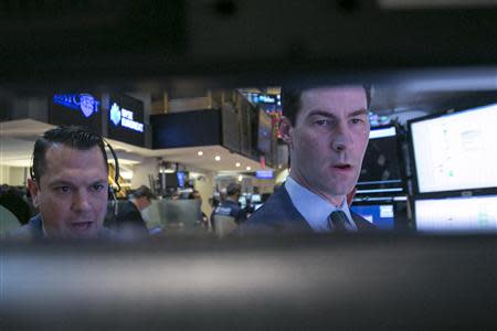 Traders work on the floor of the New York Stock Exchange December 2, 2013. REUTERS/Brendan McDermid