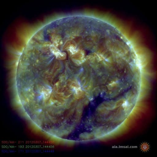 This handout image provided by NASA shows a color-coded image combining observations made by NASA's Solar Dynamics Observatory in several extreme ultraviolet wavelengths, highlighting a bright X-class flare toward the upper left of the sun's disk on March 6