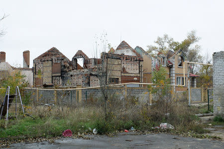 Damaged houses stand near the airport in Donetsk, Ukraine, October 25, 2017. REUTERS/Alexander Ermochenko